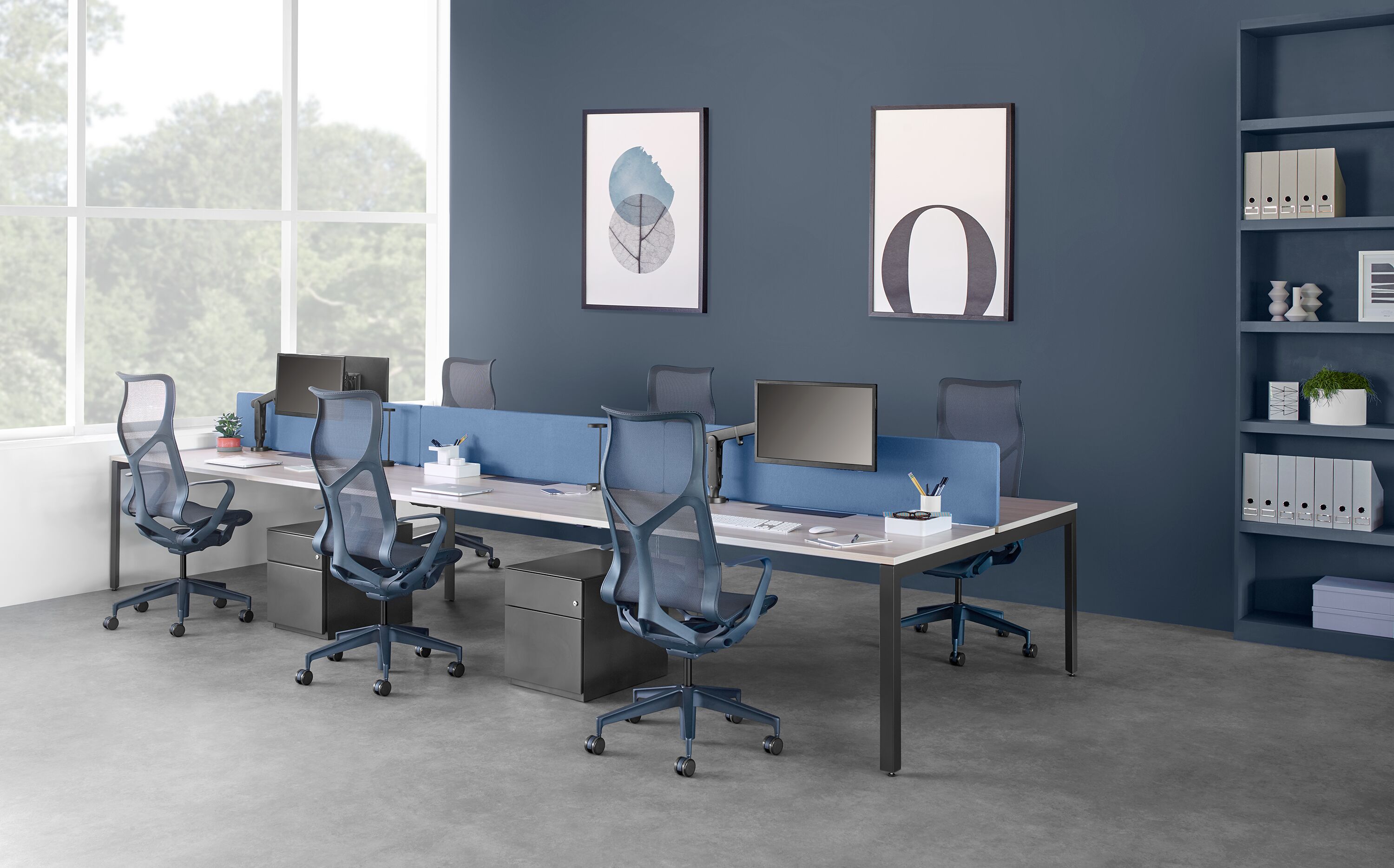 blue herman miller cosm chairs in office